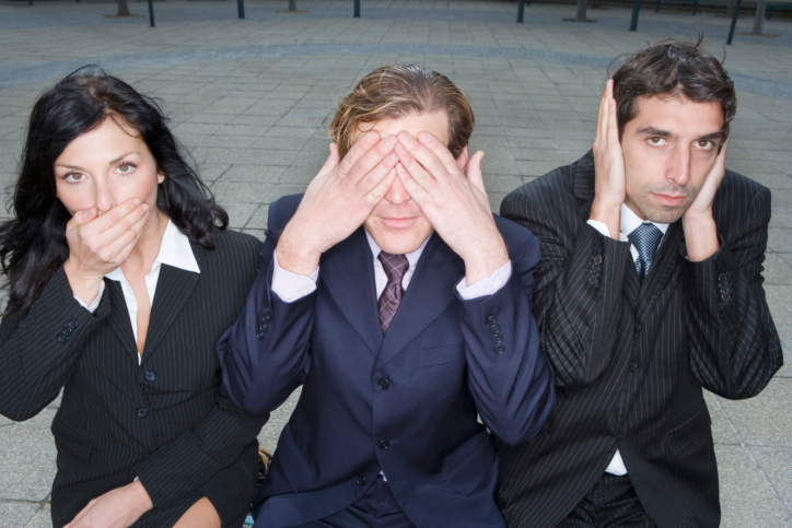Three businesspeople refusing to take any advice.