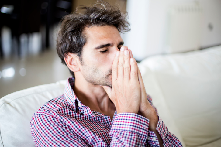 young executive looking worried and stressed out because of addiction