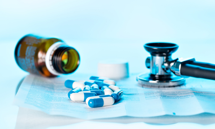 Stethoscope and spilled pill bottle