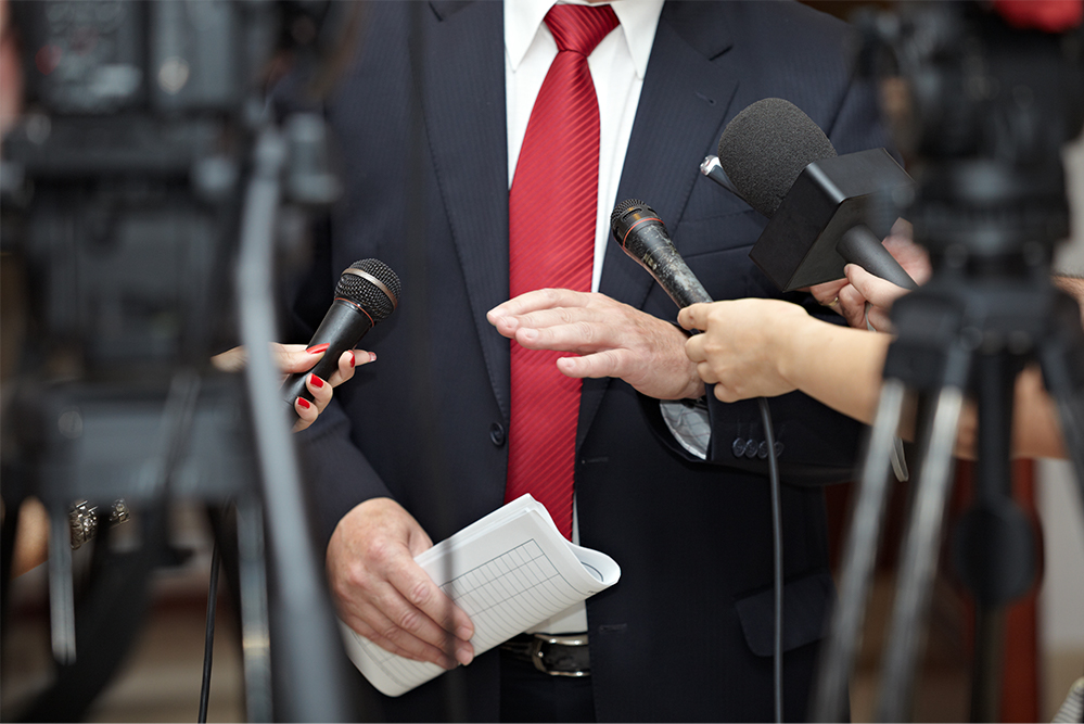 photo of a politician being interview on the campaign trail