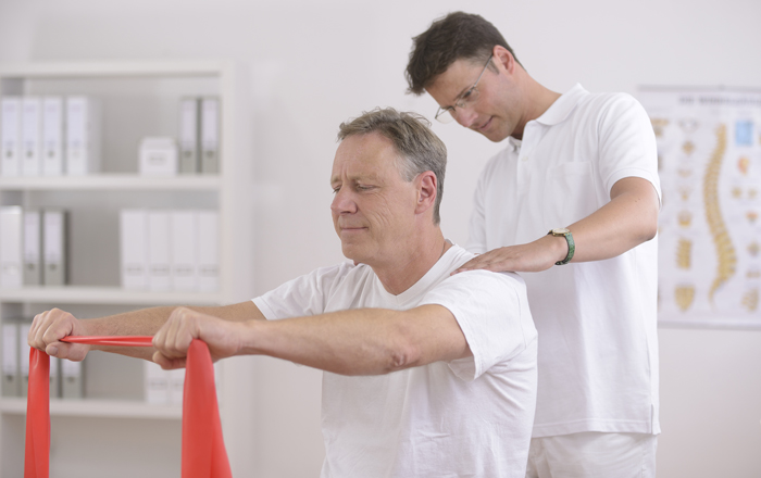 photo of a patient receiving a neck massage during physical therapy