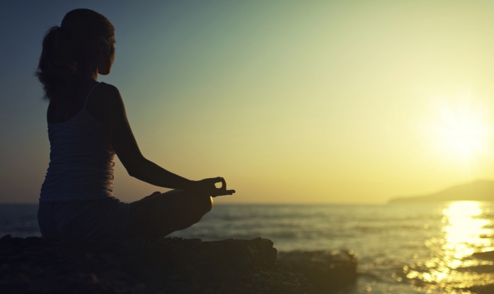 Woman mediatating during holistic drug treatment