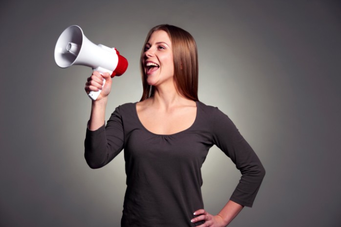 woman_shouting_out_her_success_through_megaphone